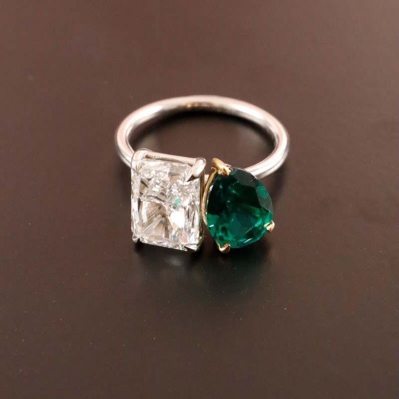 3.50ct Radiant Cut Diamond & 1.50ct Pear Shape Green Emerald engagement ring