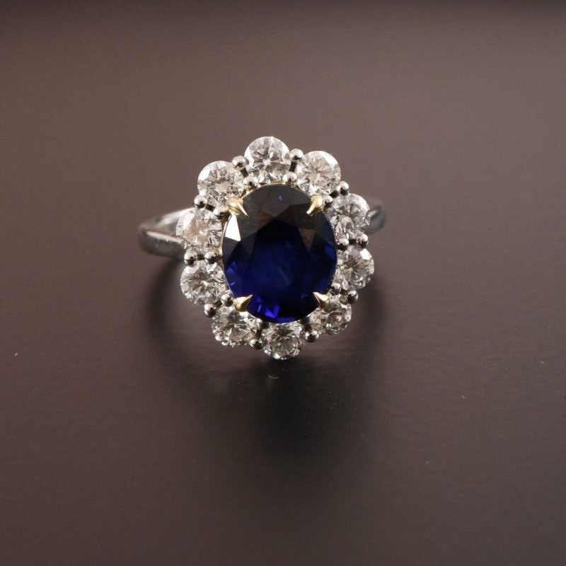 4ct Oval Blue Sapphire with 1.30ct Diamond Cluster Halo engagement ring
